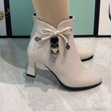 Elegant pointed ankle boots with stylish bow decoration