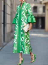 Flowing long floral pattern dress with bell sleeves and elegant side slit