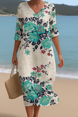 Élodie - Elegantes lange weiße Kleid mit wunderschönen türkisfarbenen Blumenverzierungen