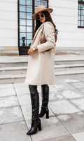 Elegant lang frakke til damer til en elegant stil