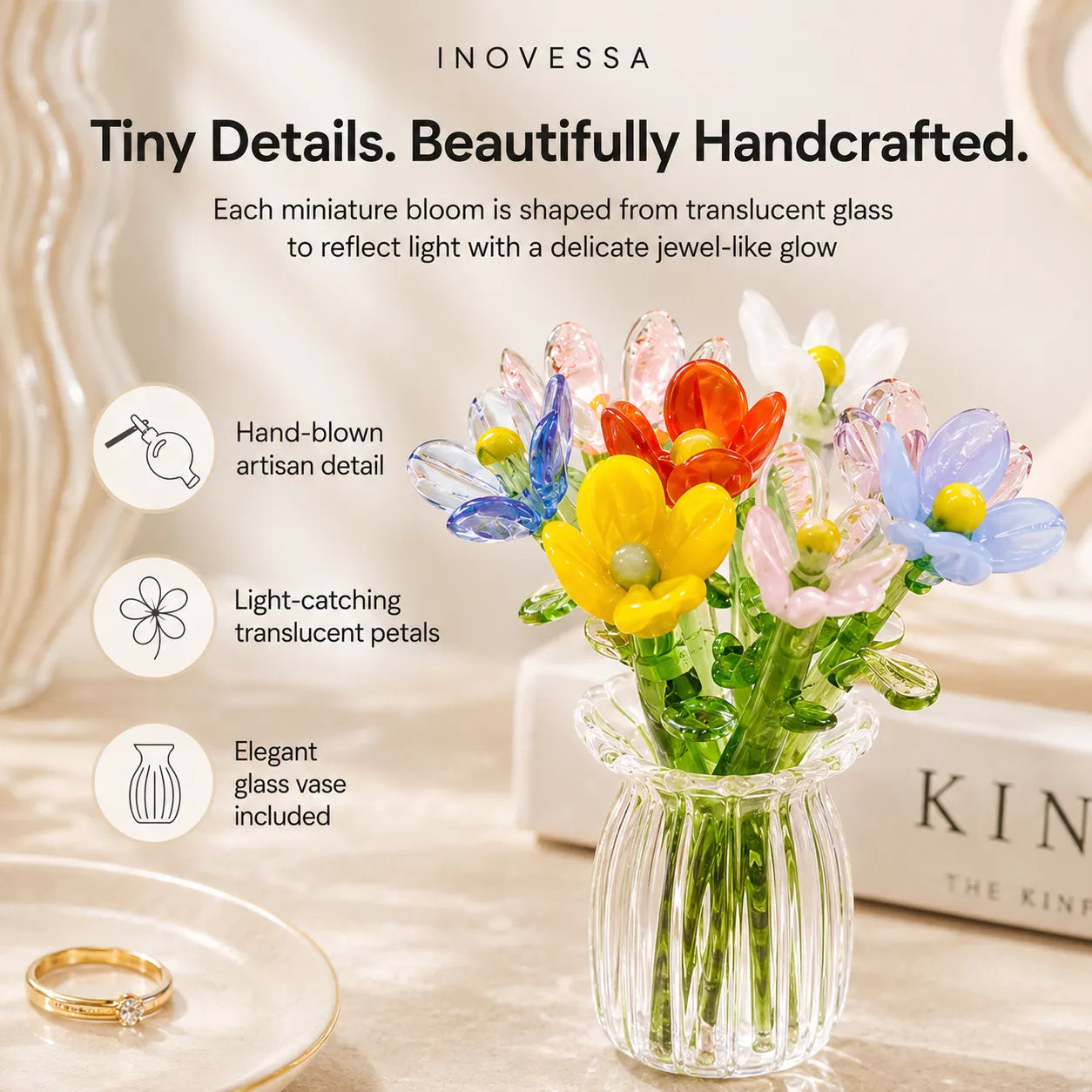 Glass flowers in a vase with branding and product features.