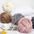 Cuscino decorativo rotondo unico fatto a mano con nodo per un tocco di stile