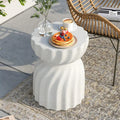 Moderne leichte Betonbeistelltisch mit stilvollem Sanduhrlook für drinnen und draußen