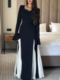 Elegante e raffinato abito maxi plissettato in bianco e nero con maniche lunghe