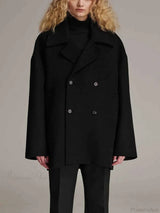 Elegant, tailored black outerwear with one button and notch collar